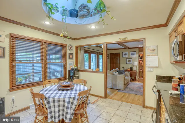 a dining room with furniture and window