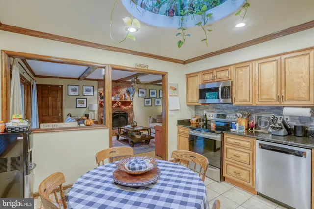 a kitchen with a table and chairs in it