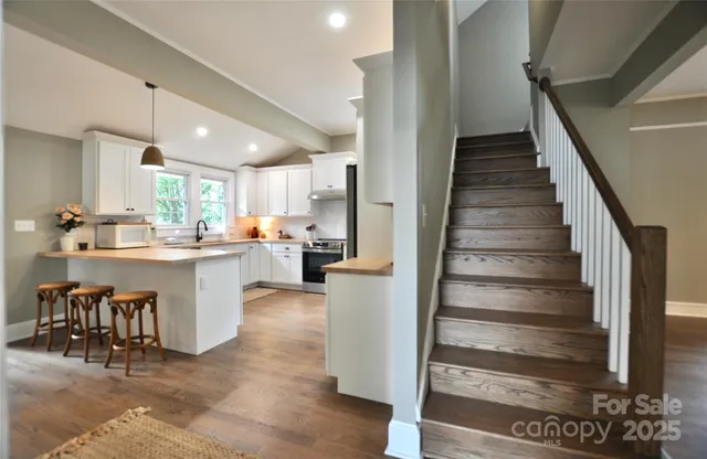 a view of kitchen with table and chairs