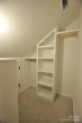 a view of an empty walk in closet