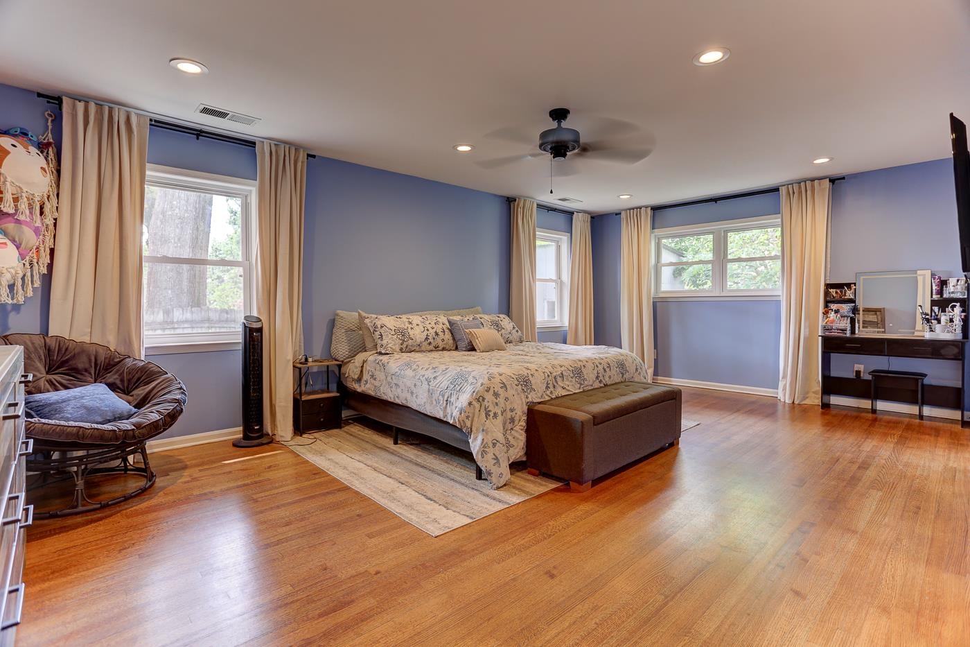 4908 Mockingbird Lane Memphis, TN 38117 - Photo 14 of 21 a bedroom with a bed and a chair