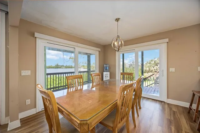 a dining room with furniture window wooden floor