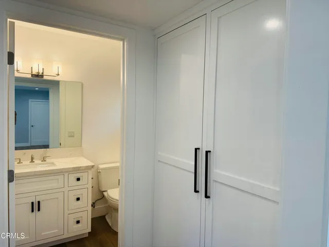 a bathroom with a double vanity sink and mirror