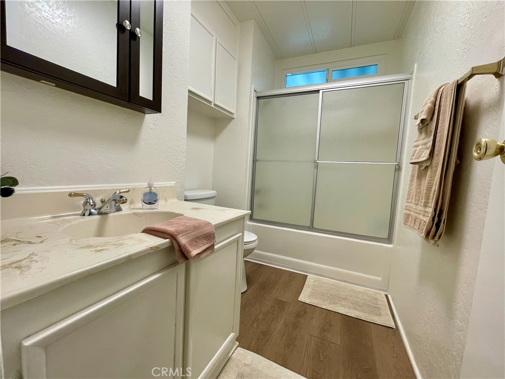 31130 South General Kearny Road, Unit 145 Temecula, CA 92591 - Photo 14 of 27 a bathroom with a sink and mirror
