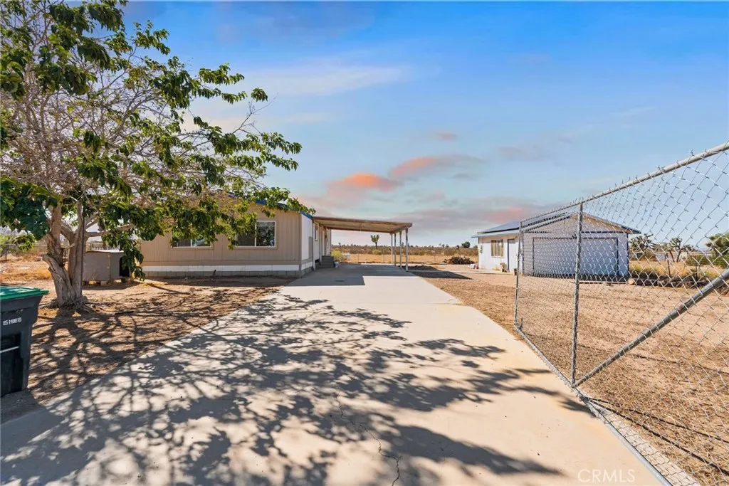 11772 Middleton Road Phelan, CA 92371 - Photo 38 of 40 a house with trees in front of it