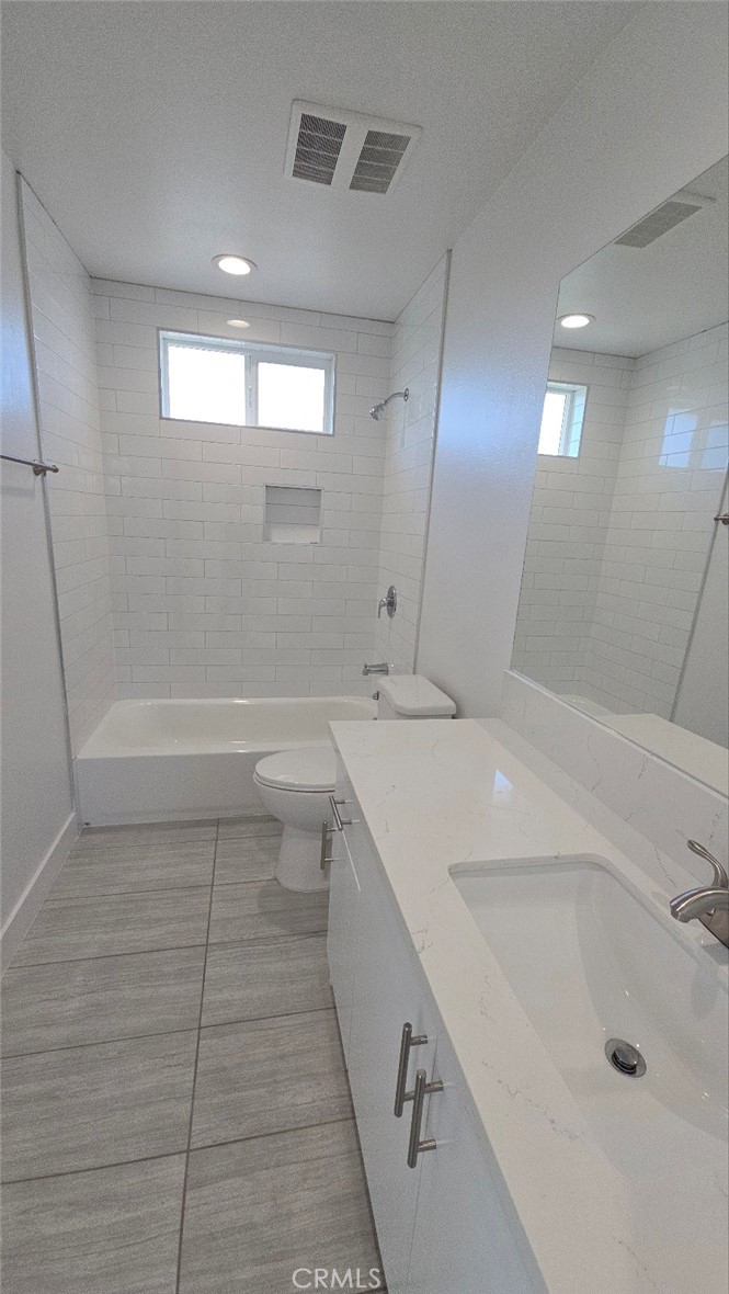 10413 Avalon Boulevard Los Angeles, CA 90003 - Photo 11 of 23 a bathroom with a sink a toilet and shower