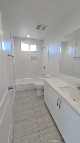 a kitchen with stainless steel appliances granite countertop a sink a stove and a window