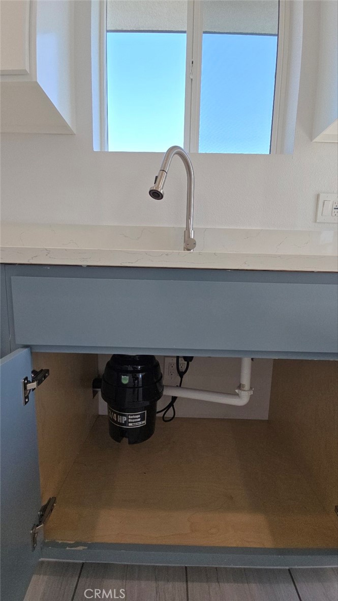 10413 Avalon Boulevard Los Angeles, CA 90003 - Photo 17 of 23 a bathroom with a sink and a mirror