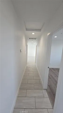 a view of a hallway with stairs