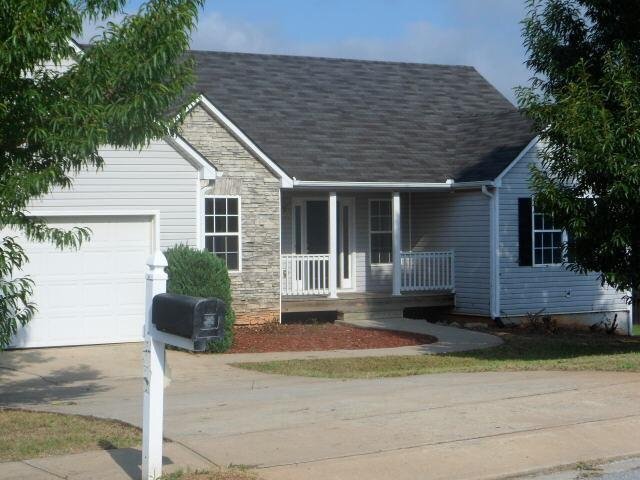 288 Rockingham Drive Loganville, GA 30052 - Photo 1 of 1 a front view of a house with garden