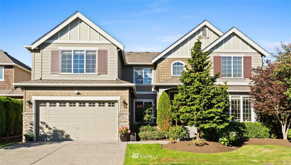 18412 36th Avenue Southeast Bothell, WA 98012 - Photo 1 of 1 a view of a house with a yard and plants