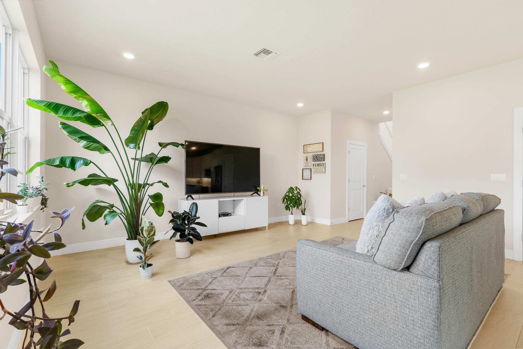 4374 Greenway Drive Hollywood, FL 33021 - Photo 12 of 46 a living room with furniture potted plant and a flat screen tv