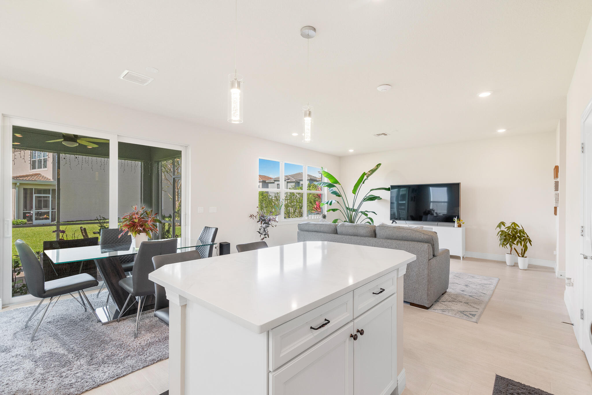 4374 Greenway Drive Hollywood, FL 33021 - Photo 15 of 46 a large living room with stainless steel appliances kitchen island granite countertop furniture and a flat screen tv