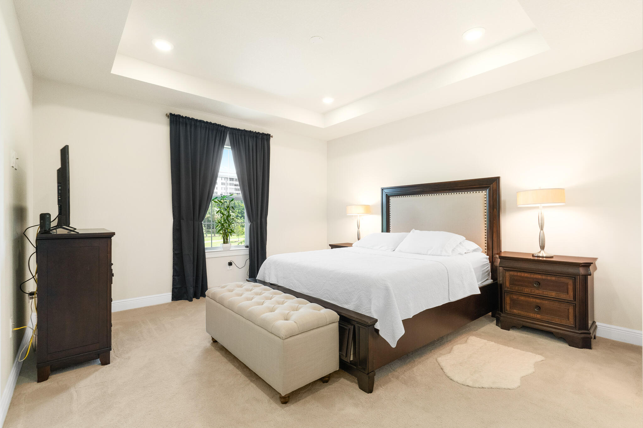 4374 Greenway Drive Hollywood, FL 33021 - Photo 19 of 46 a bedroom with a bed and a potted plant