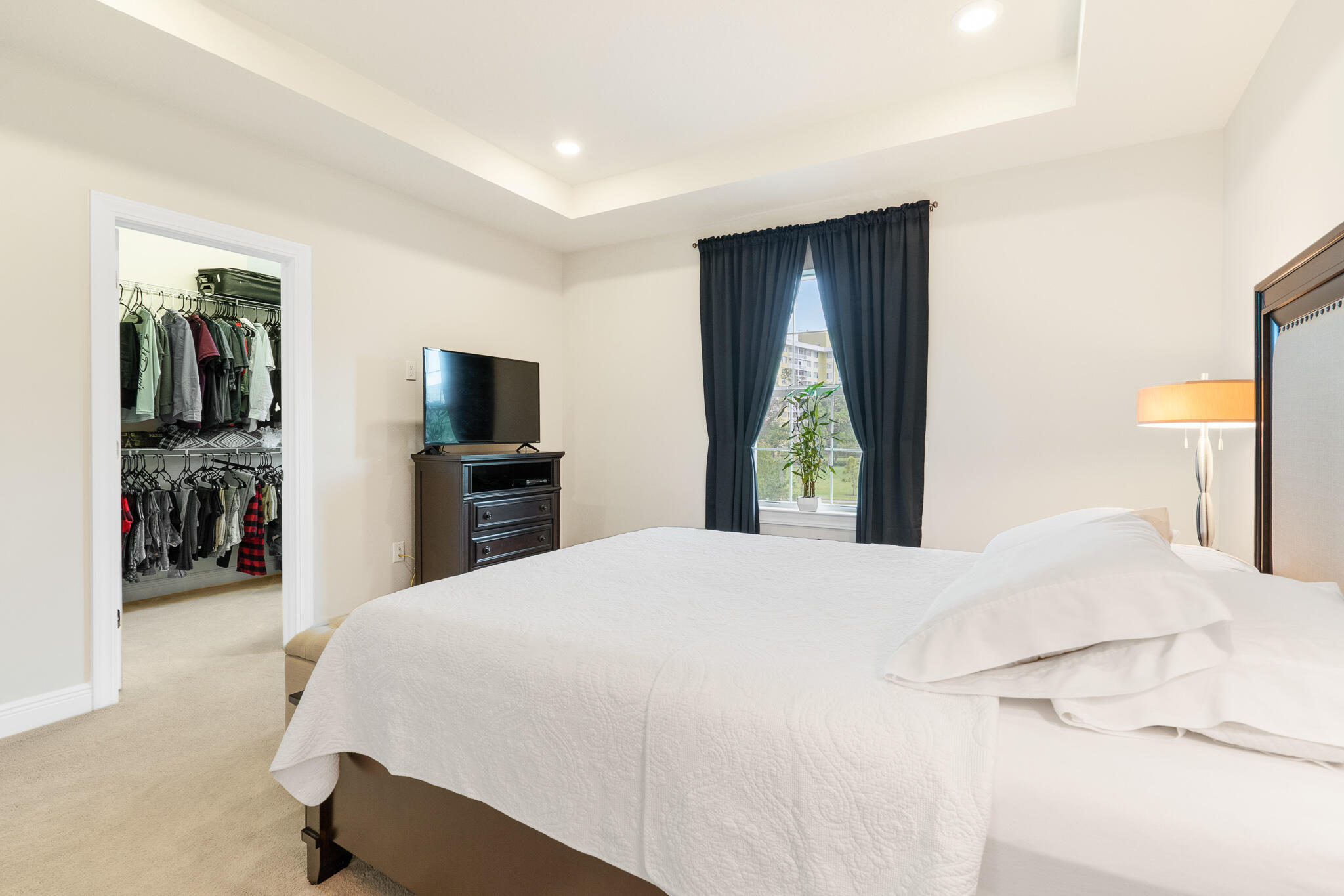 4374 Greenway Drive Hollywood, FL 33021 - Photo 20 of 46 a bedroom with a large bed and a flat tv screen