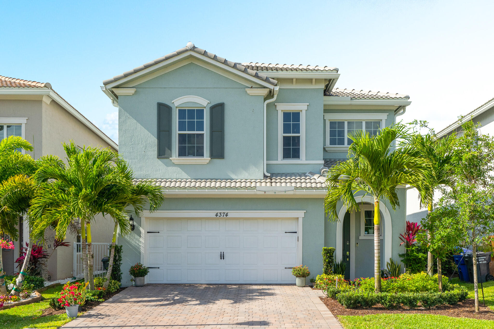 4374 Greenway Drive Hollywood, FL 33021 - Photo 2 of 46 a front view of a house with a yard