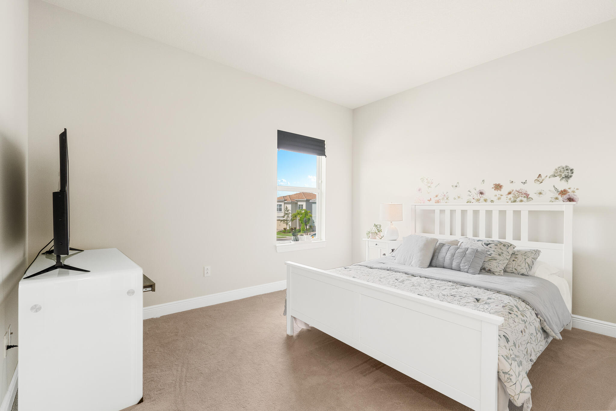 4374 Greenway Drive Hollywood, FL 33021 - Photo 27 of 46 a bedroom with a bed and a flat screen tv