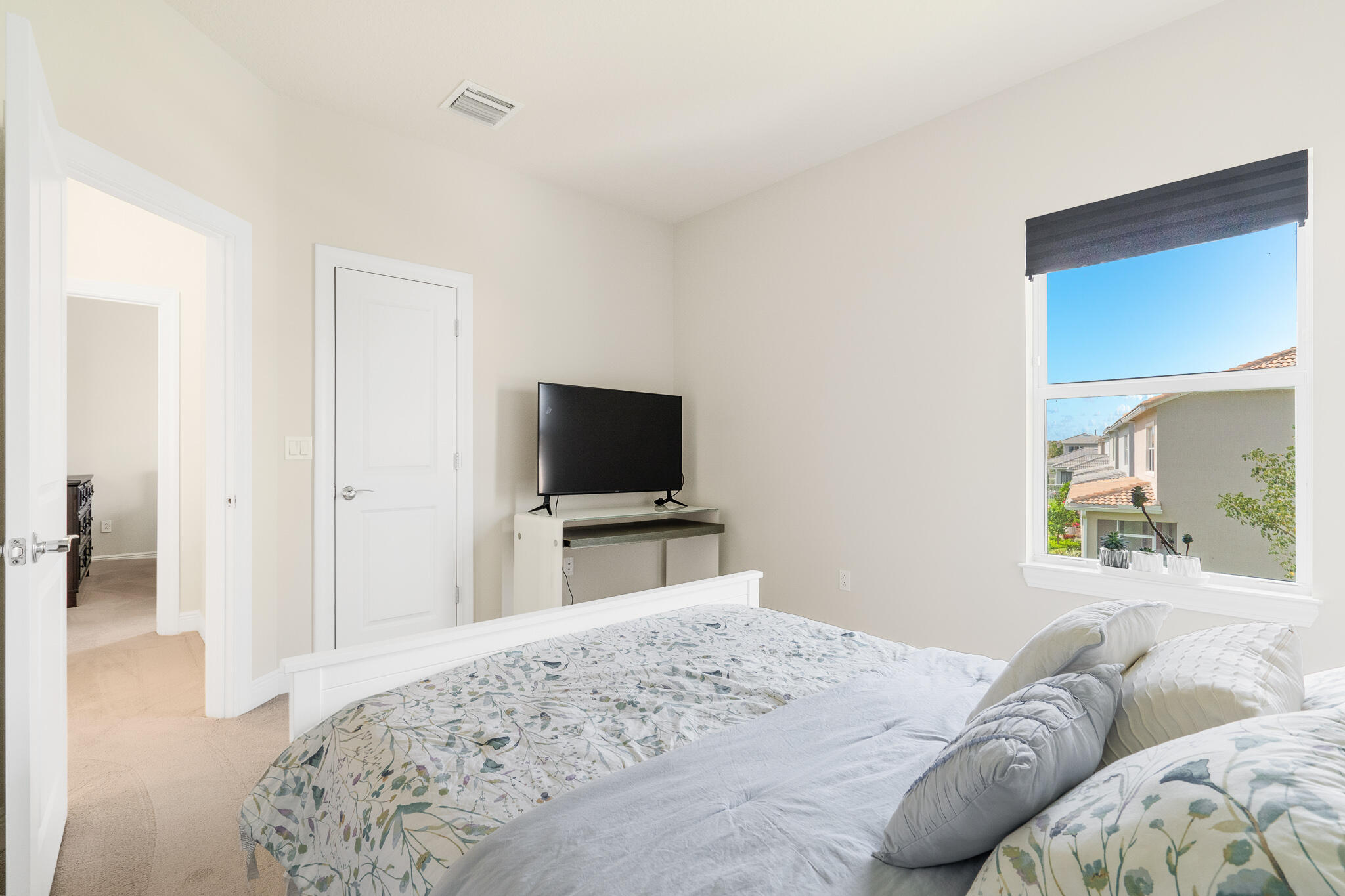 4374 Greenway Drive Hollywood, FL 33021 - Photo 30 of 46 a bedroom with a bed and a flat screen tv