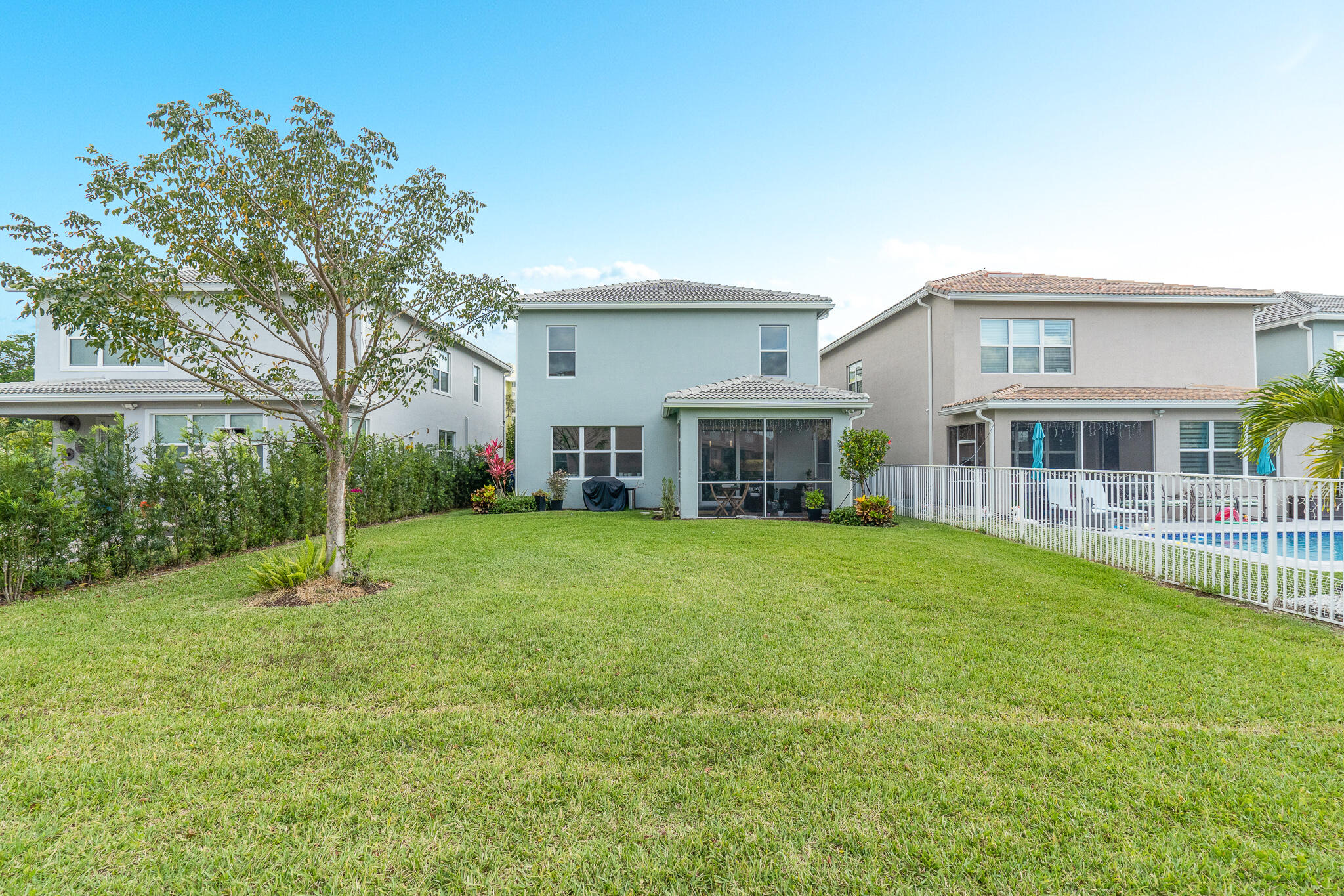 4374 Greenway Drive Hollywood, FL 33021 - Photo 35 of 46 a front view of a house with a garden