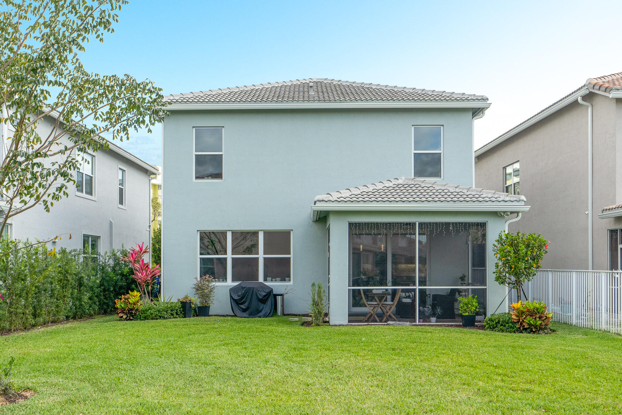 4374 Greenway Drive Hollywood, FL 33021 - Photo 36 of 46 a view of a house with a yard and plants with large windows