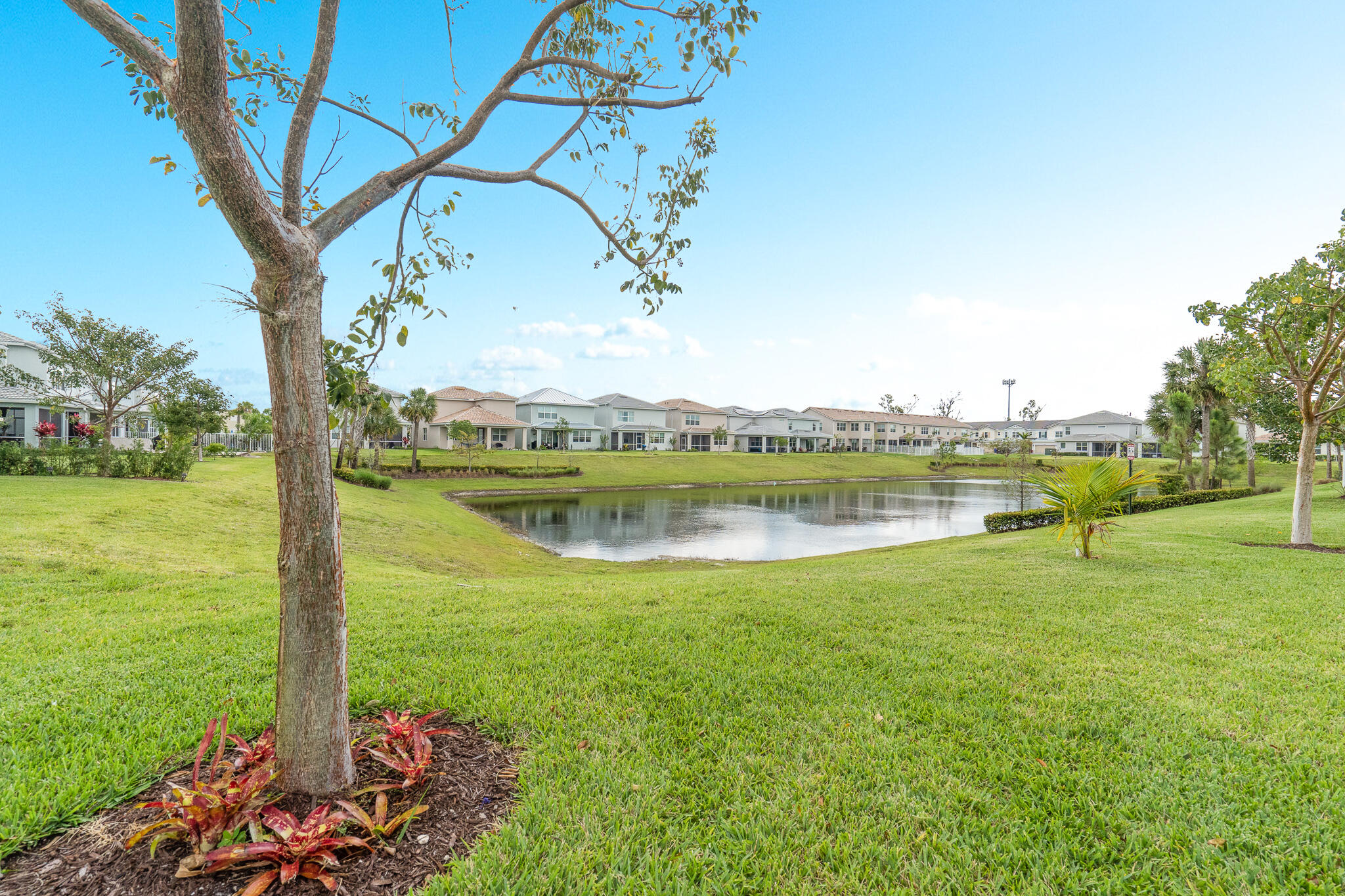 4374 Greenway Drive Hollywood, FL 33021 - Photo 37 of 46 a view of a lake with a house in the background