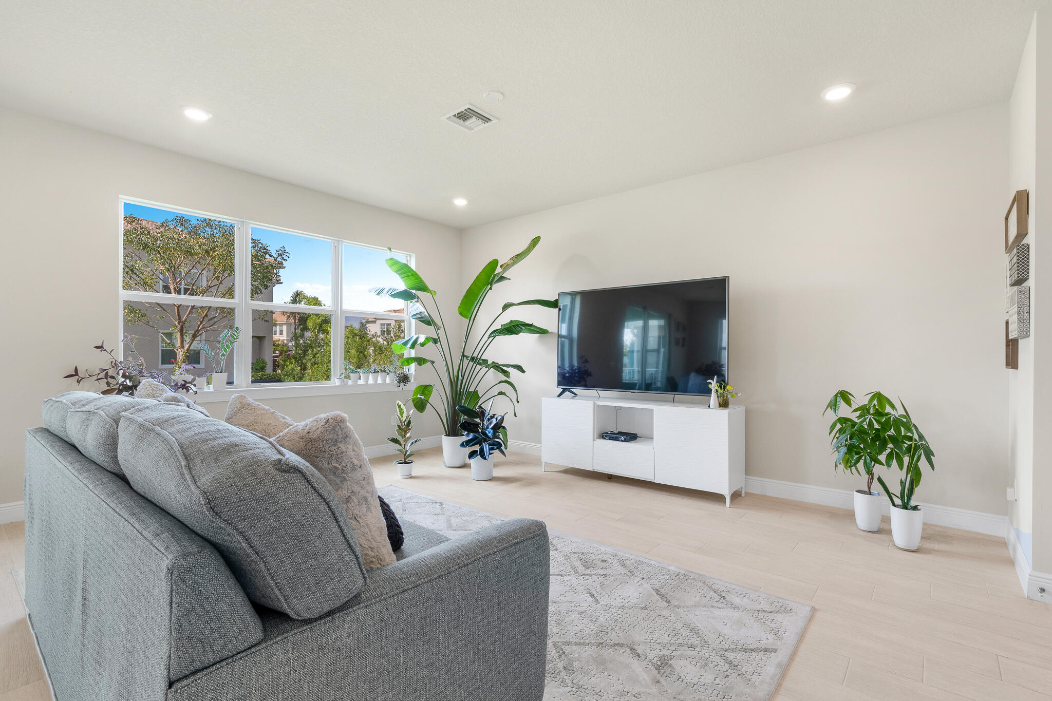 4374 Greenway Drive Hollywood, FL 33021 - Photo 8 of 46 a living room with furniture and a flat screen tv