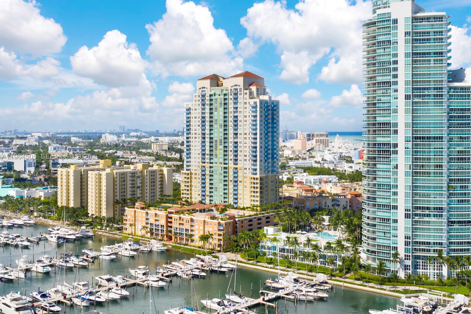 90 Alton Road, Unit 902 Miami Beach, FL 33139 - Photo 34 of 34 a view of a lake with tall buildings