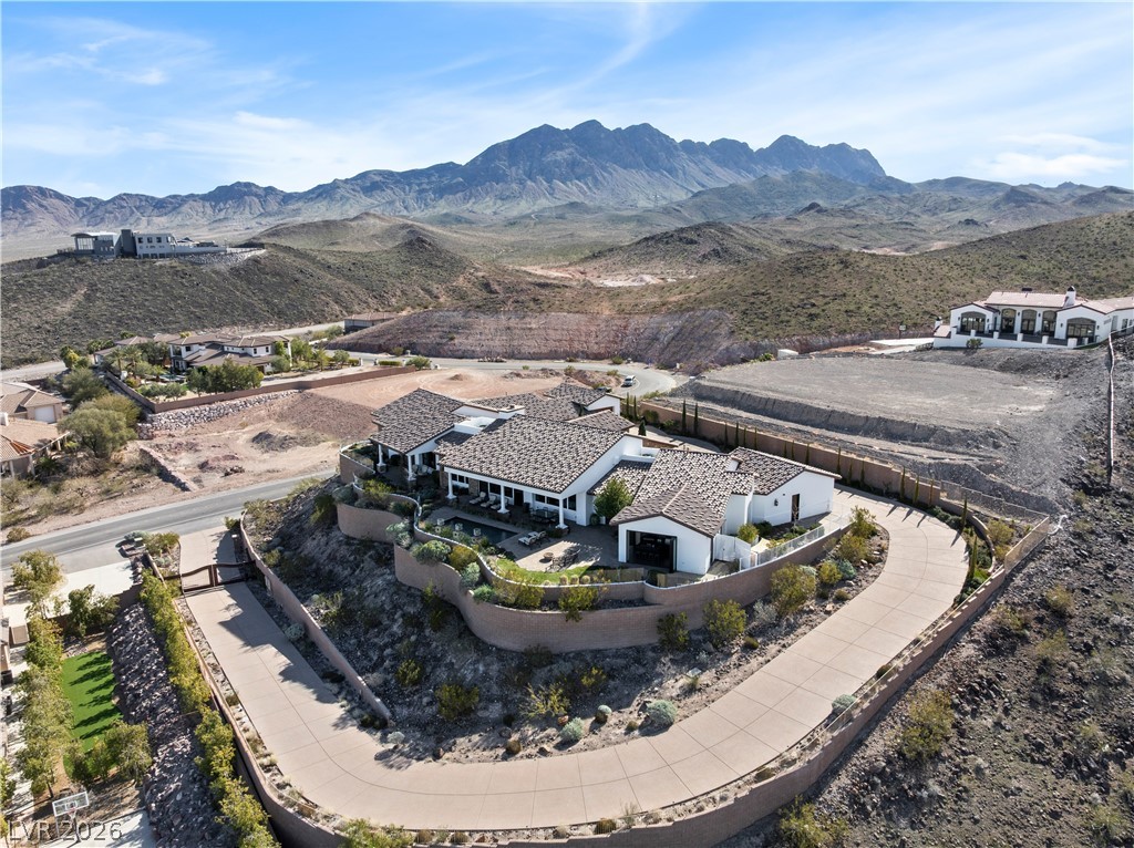 1123 Christian Road Henderson, NV 89002 - Photo 81 of 94 Perched on a hill, this desert dwelling commands sweeping mountain views with its private drive.