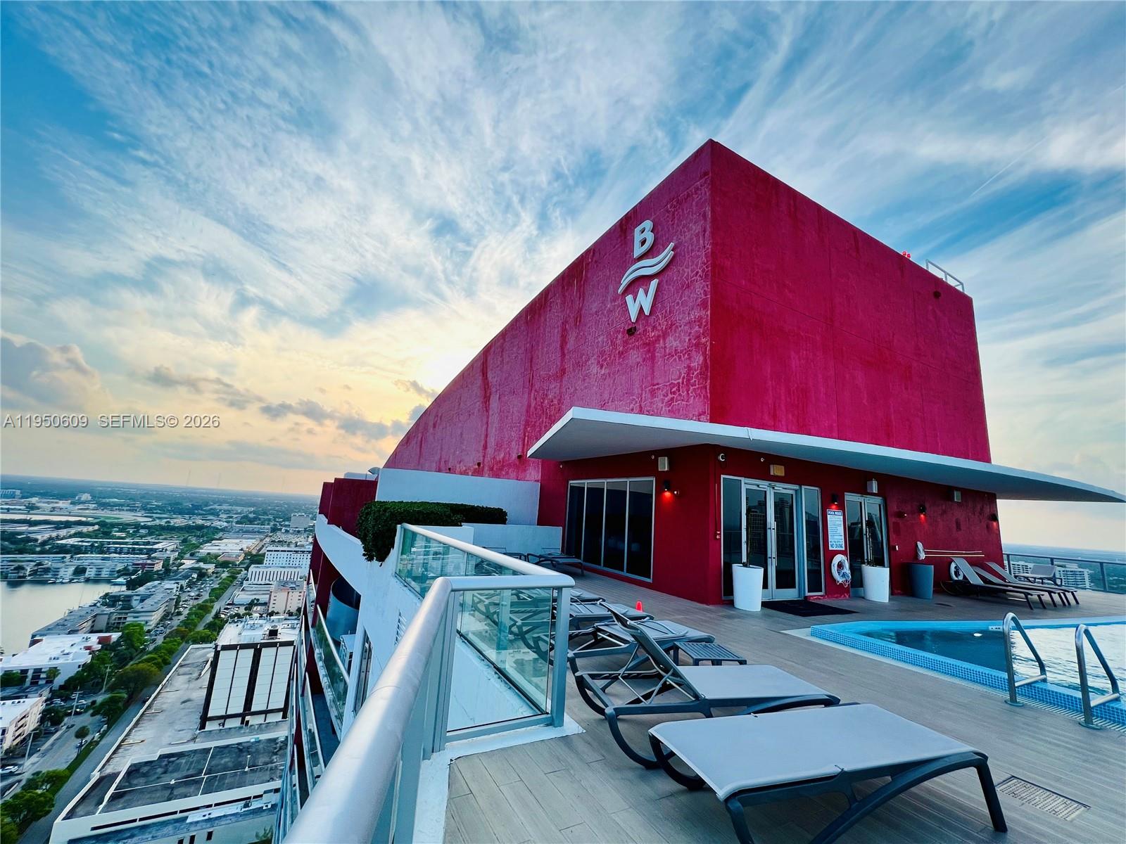 2602 East Hallandale Beach Boulevard, Unit R409 Hallandale Beach, FL 33009 - Photo 1 of 48 an outdoor space with furniture