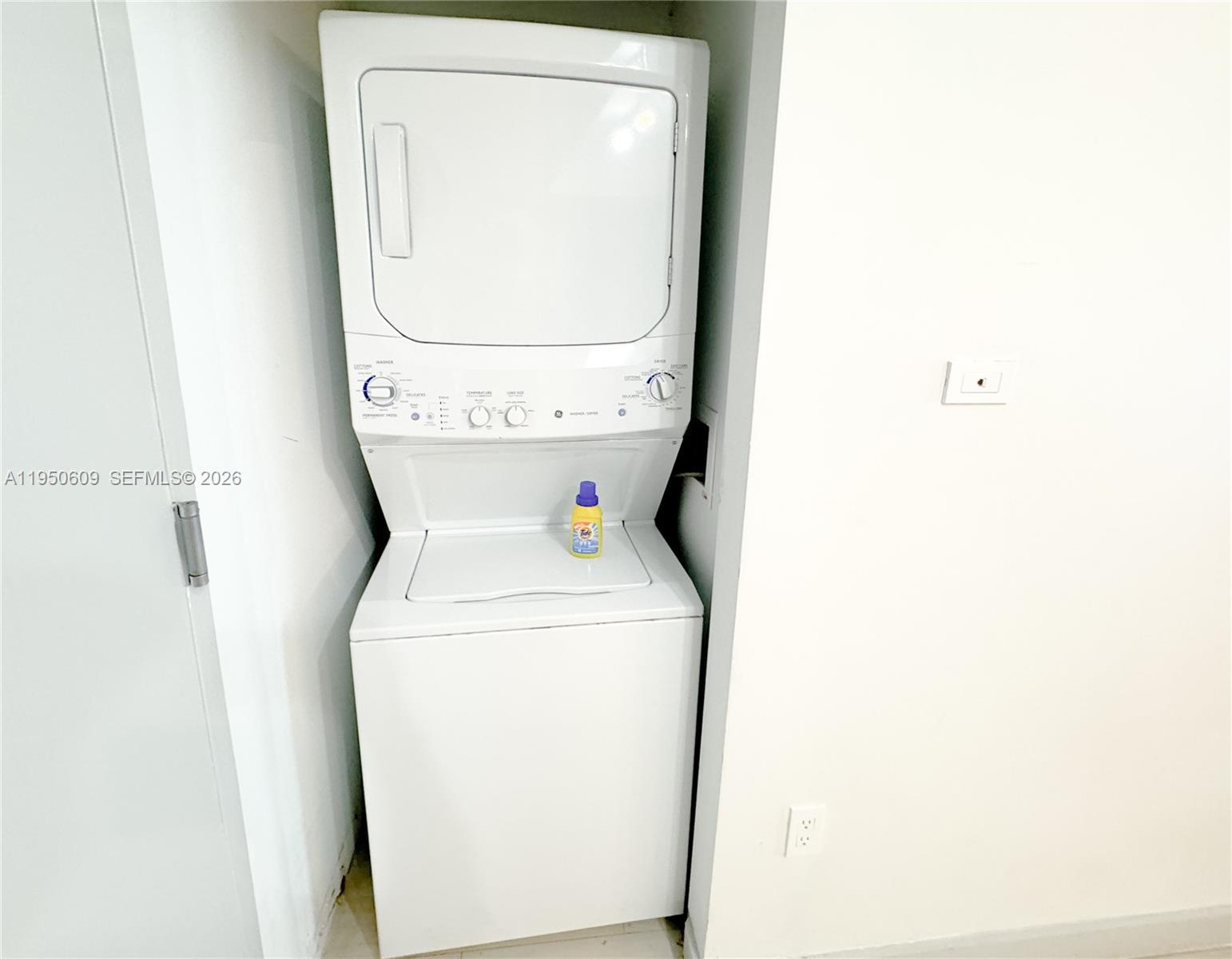 2602 East Hallandale Beach Boulevard, Unit R409 Hallandale Beach, FL 33009 - Photo 12 of 48 a utility room with dryer and washer