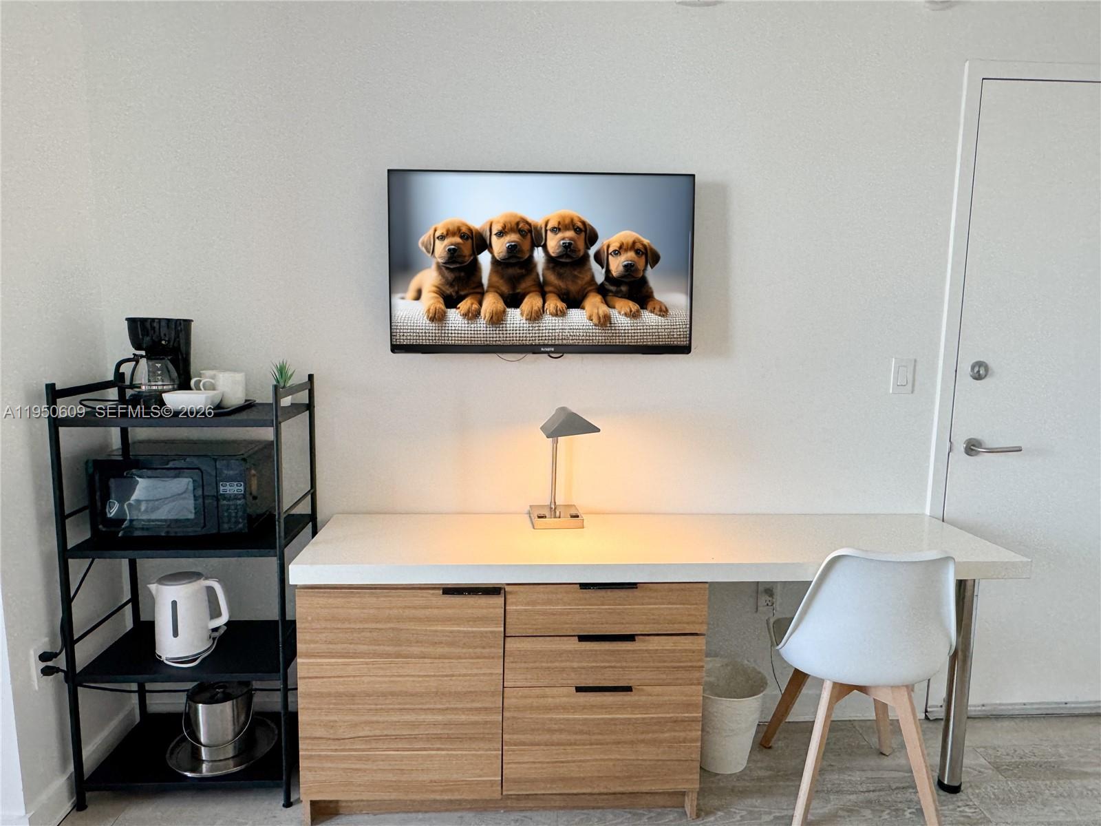 2602 East Hallandale Beach Boulevard, Unit R409 Hallandale Beach, FL 33009 - Photo 30 of 48 a view of a workspace with furniture