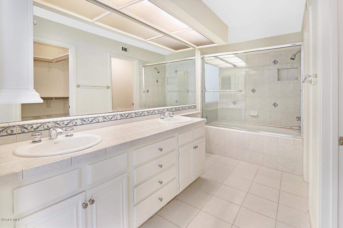 851 Congressional Road Simi Valley, CA 93065 - Photo 15 of 28 a spacious bathroom with a shower sink and a mirror