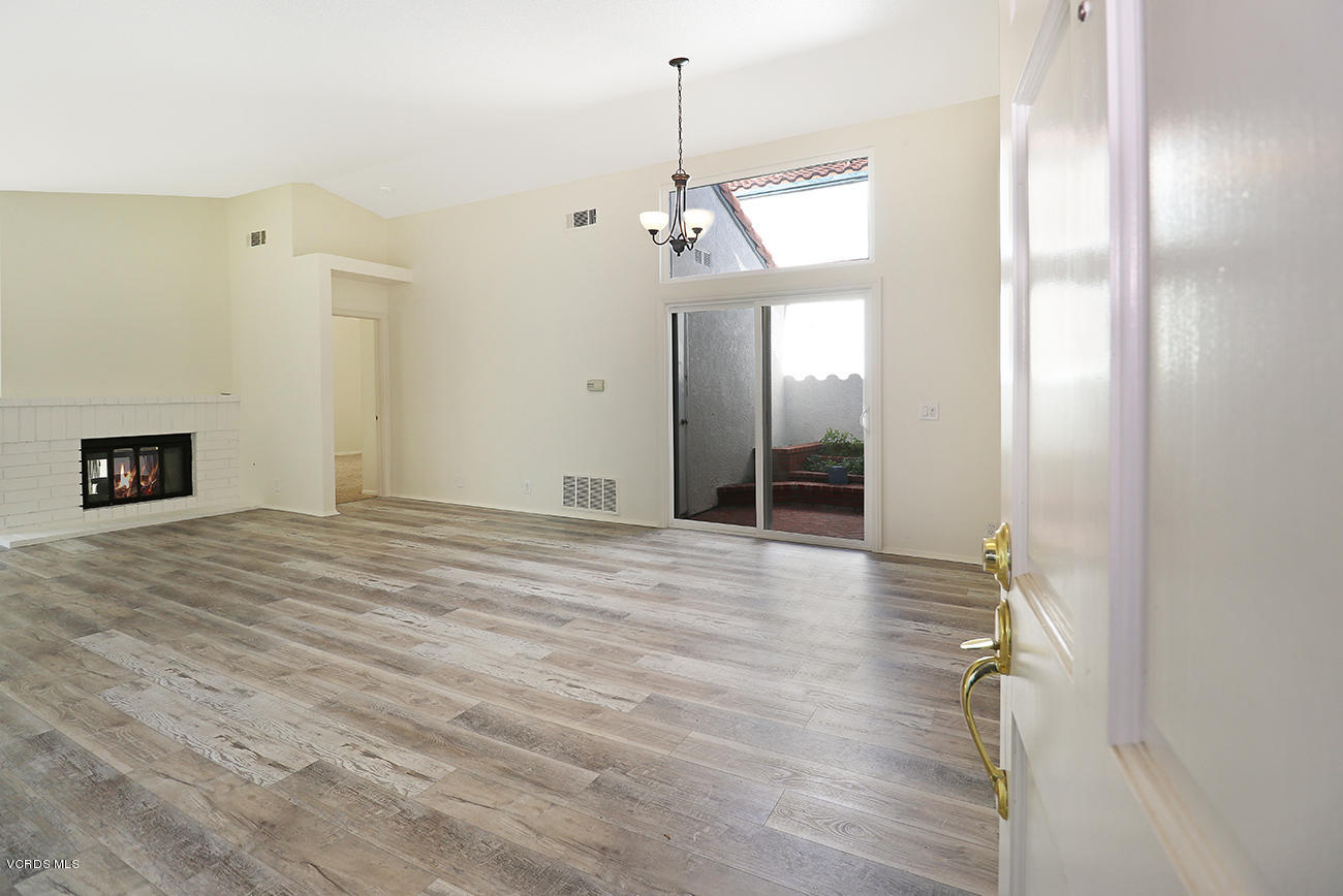 851 Congressional Road Simi Valley, CA 93065 - Photo 6 of 28 a view of a room with wooden floor and a ceiling fan