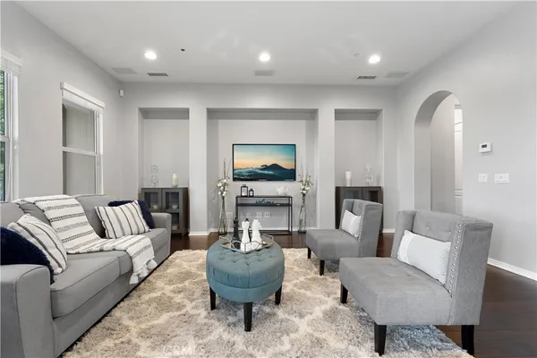 a living room with furniture and a fireplace