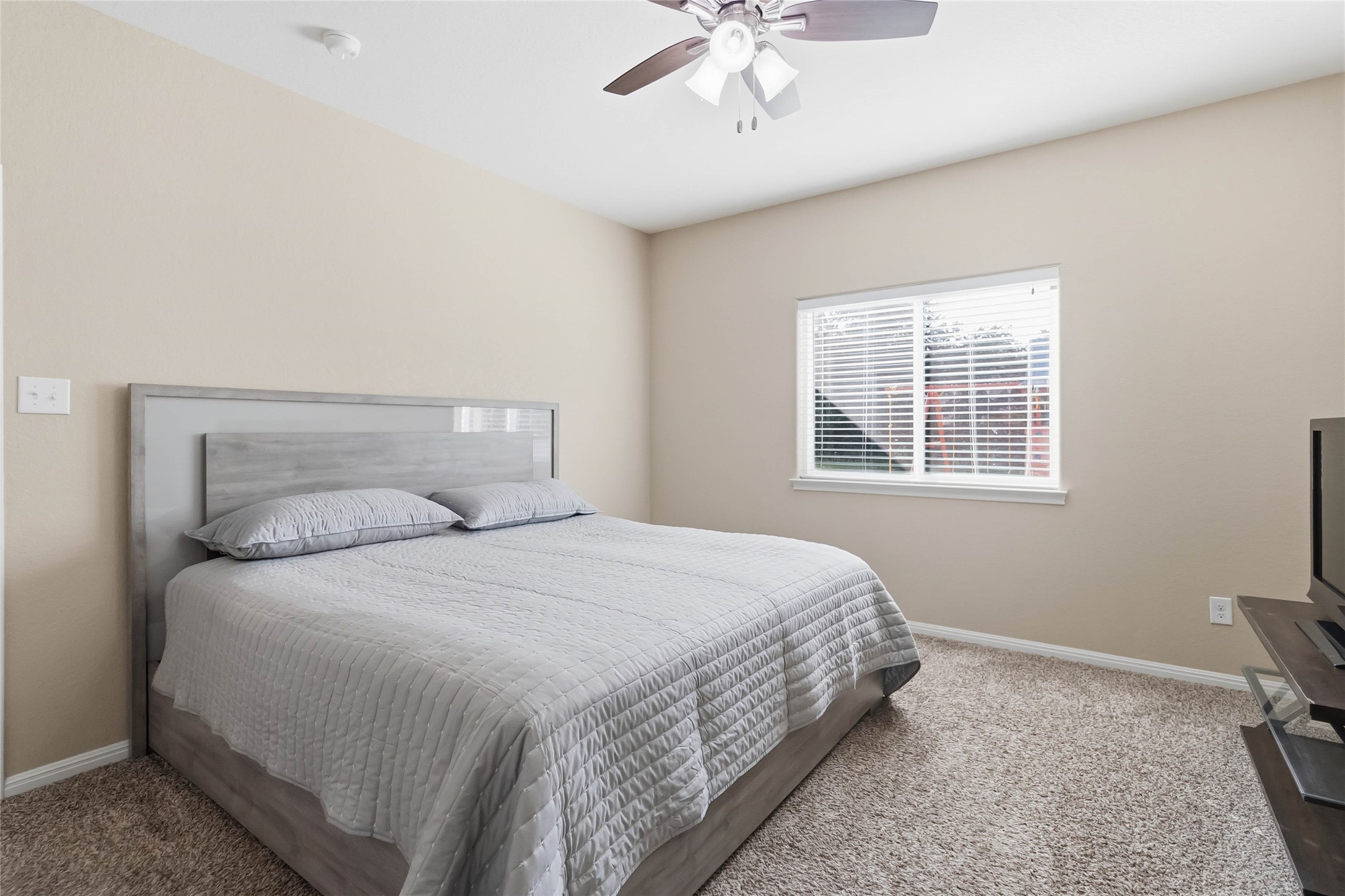 285 Hummingbird Way Martindale, TX 78655 - Photo 19 of 40 a bedroom with a bed and window