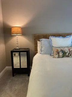 a bedroom with a bed and window