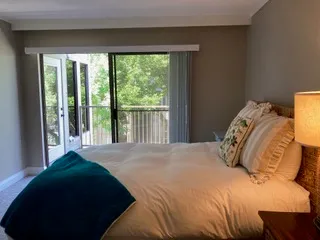 a bed room with a bed and a night stand