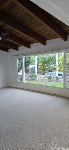 a view of a room with a large window