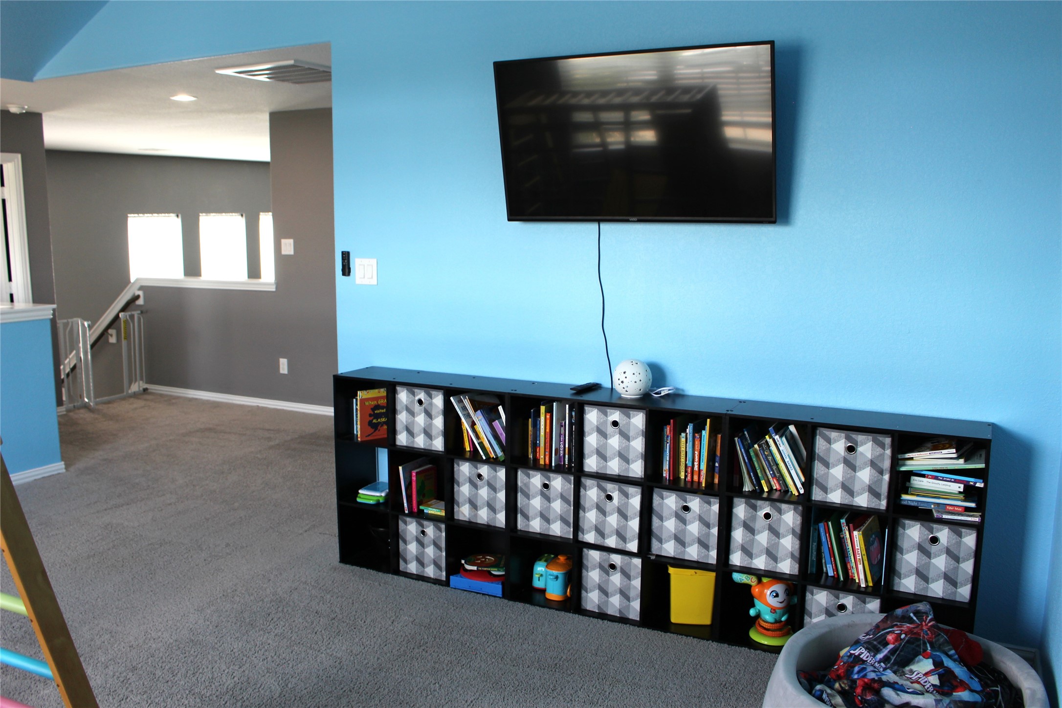 104 Kelly Street Angleton, TX 77515 - Photo 14 of 20 a living room with fish tank and a bookshelf