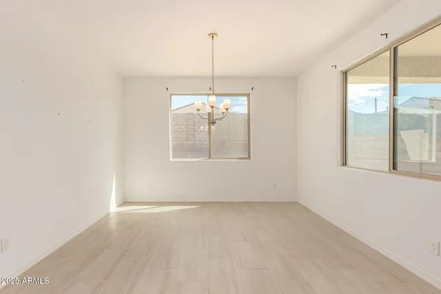 a kitchen with stainless steel appliances a sink stove and refrigerator