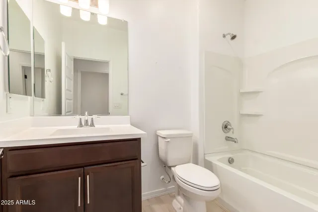 an empty room with closet and cabinet