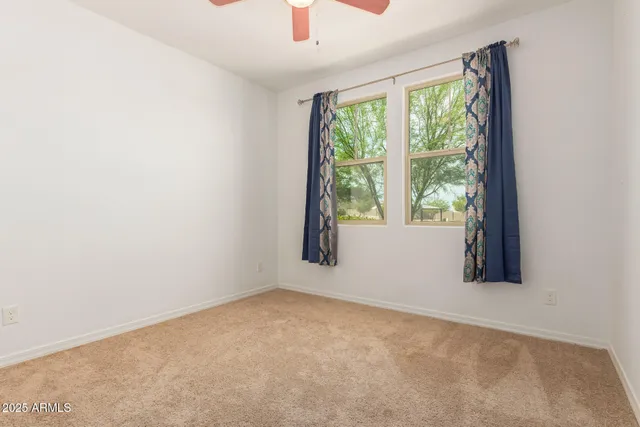 a bathroom with a sink a toilet a tub and shower