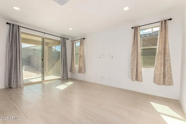 a large kitchen with kitchen island a sink stainless steel appliances and cabinets