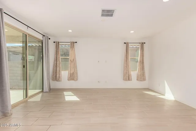 a kitchen that has a sink a stove and a oven