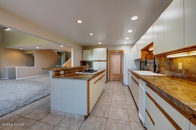 2640 Rockview Drive Reno, NV 89519 - Photo 27 of 56 a large kitchen with stainless steel appliances granite countertop a large counter top and a stove
