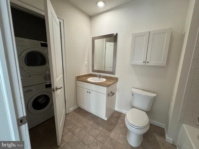 a view of a hallway with washer and dryer