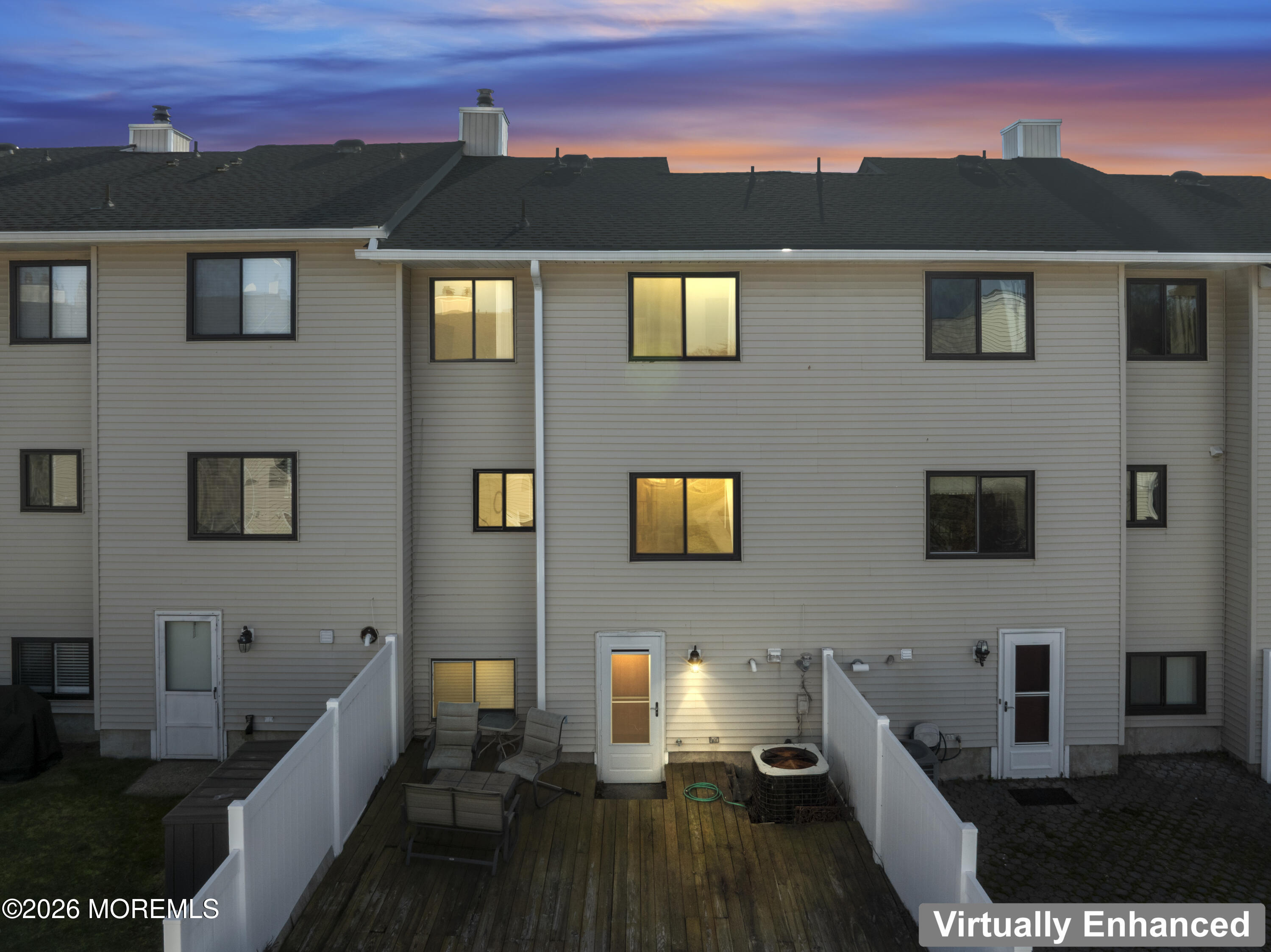 424 Middlewood Road Middletown, NJ 07748 - Photo 22 of 22 a view of a balcony with two chairs and a potted plant