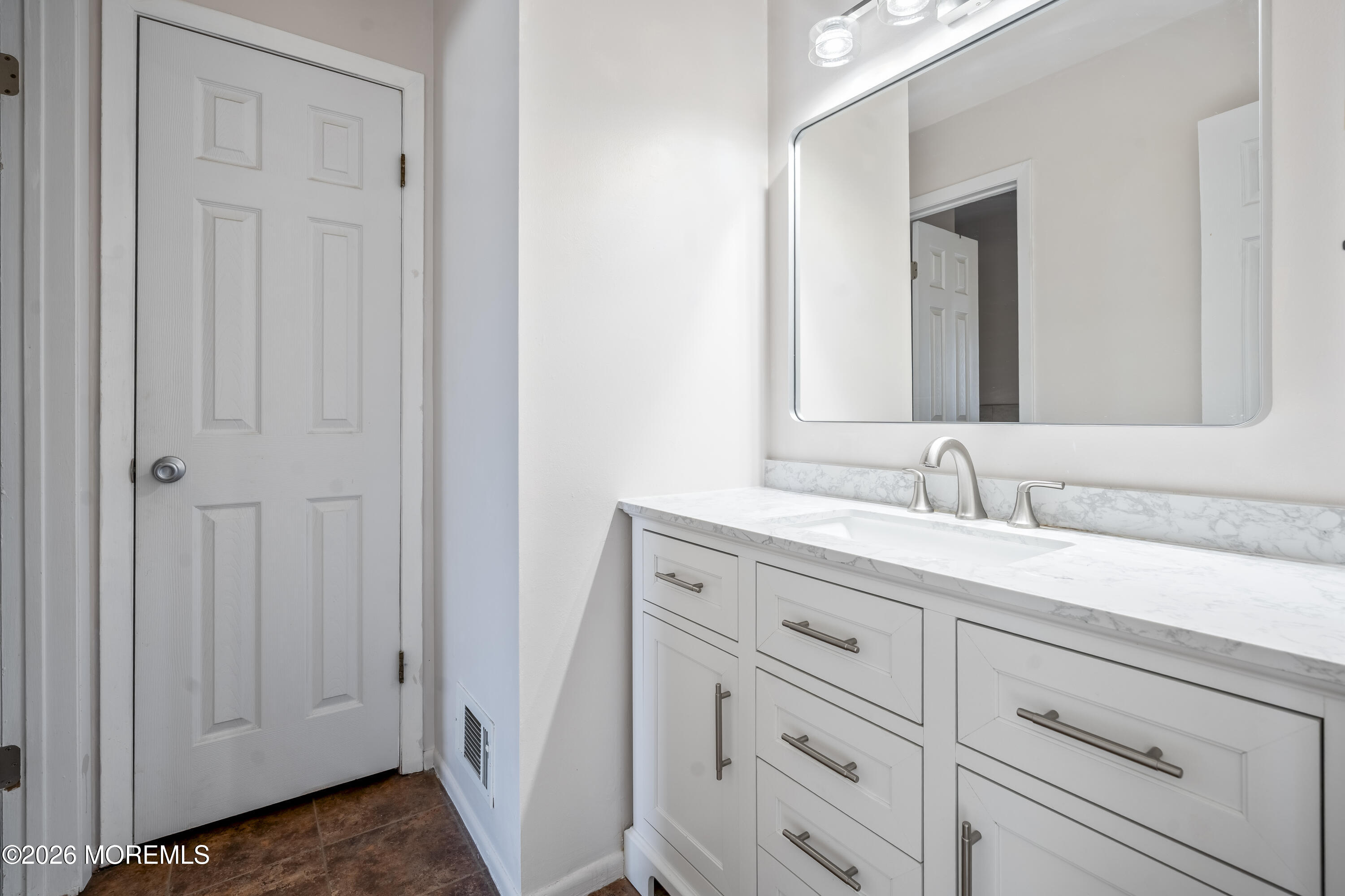 424 Middlewood Road Middletown, NJ 07748 - Photo 9 of 22 a bathroom with a granite countertop sink and a mirror