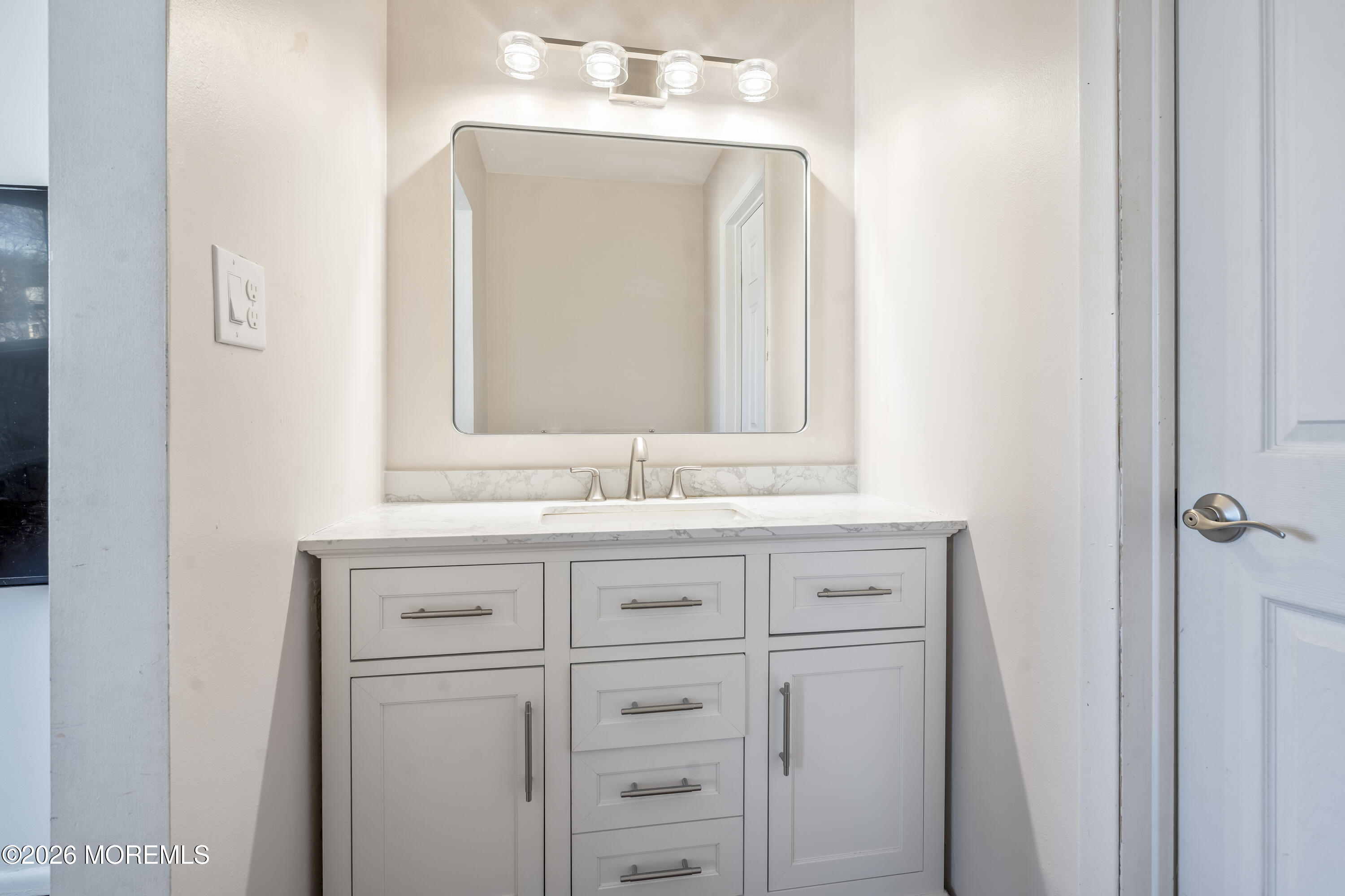 424 Middlewood Road Middletown, NJ 07748 - Photo 10 of 22 a bathroom with a granite countertop sink vanity and mirror