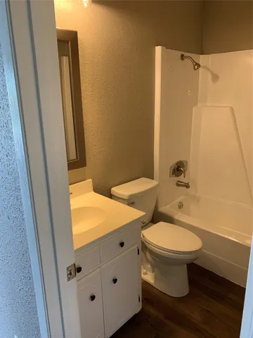a bathroom with a sink and toilet